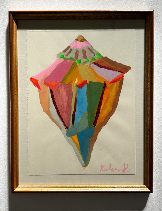 Framed abstract art piece with colorful geometric design on a light background