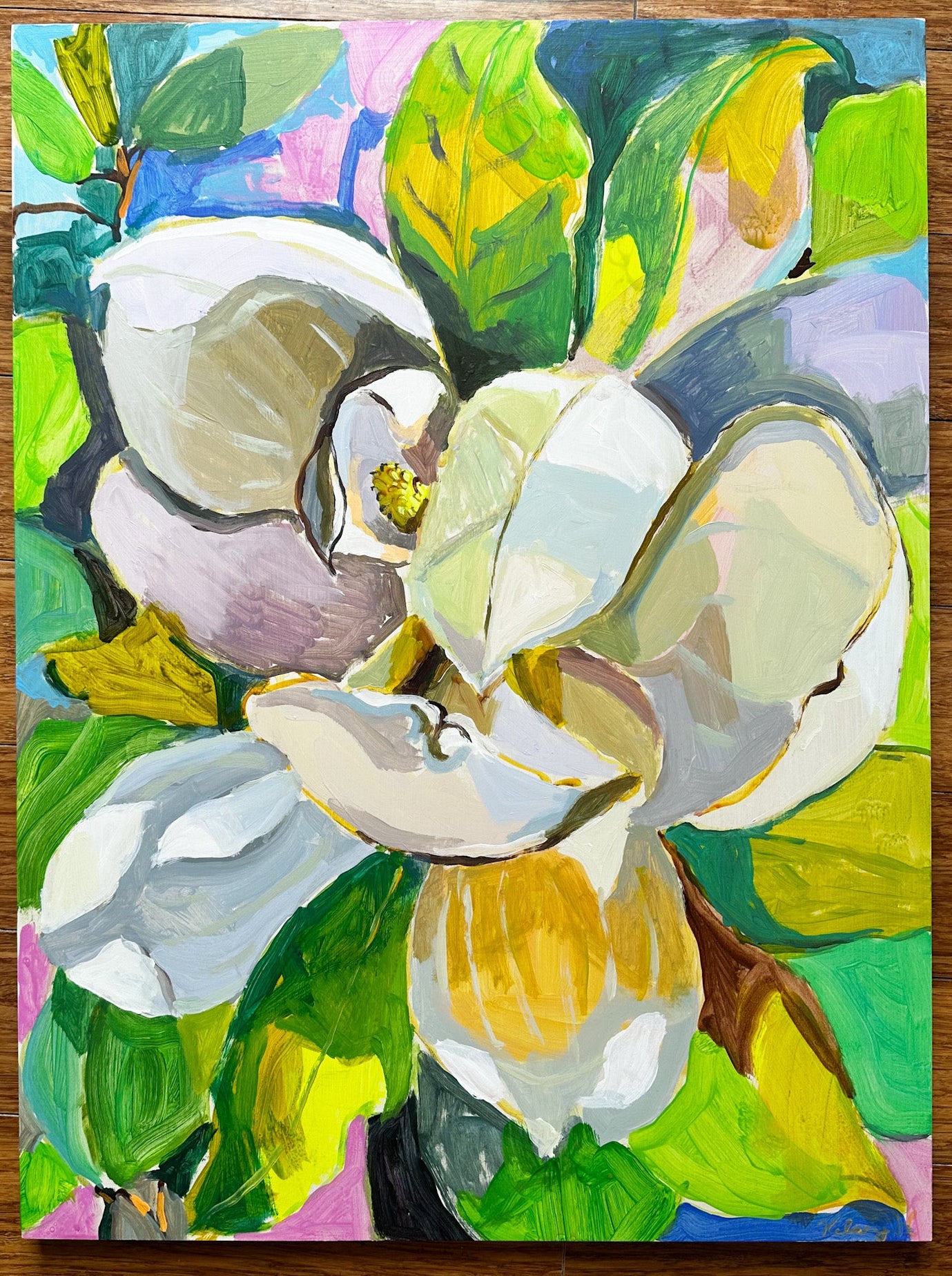 Colorful painting of flowers and leaves on a wooden surface