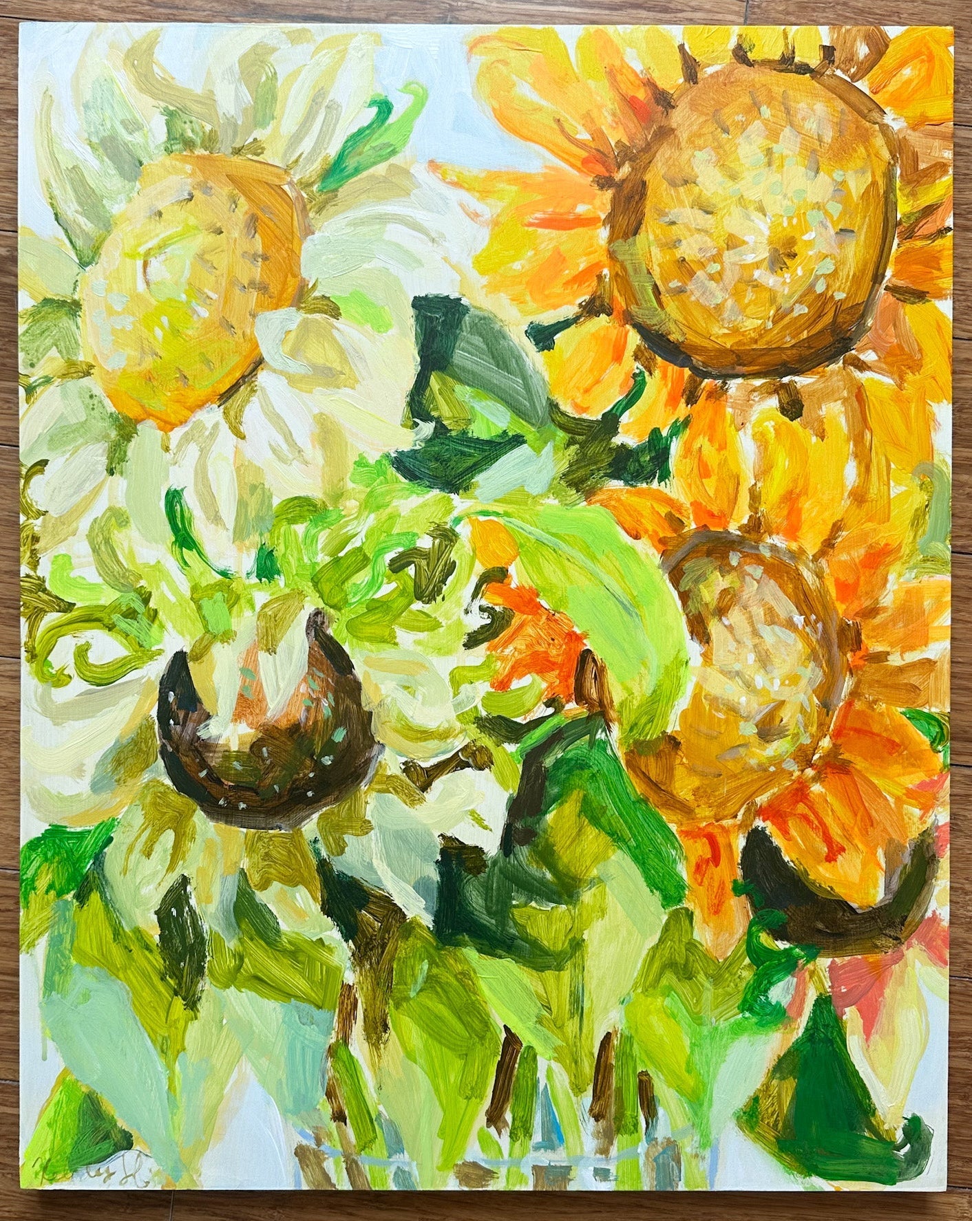 Painting of sunflowers on a wooden surface