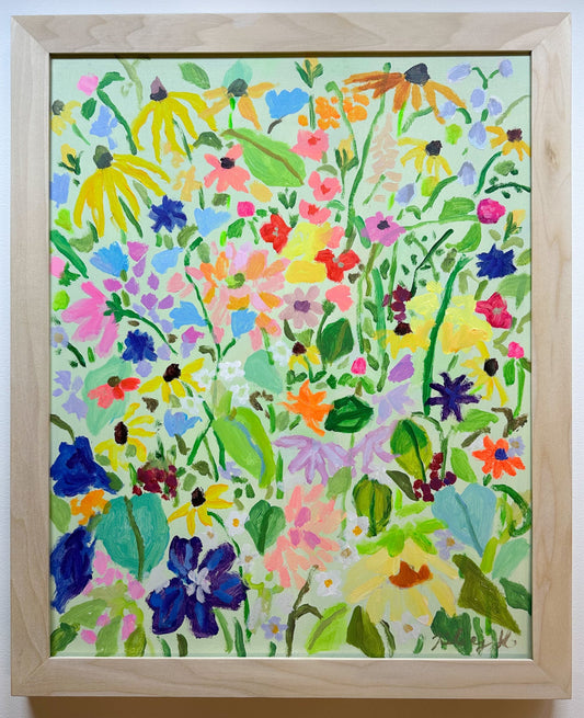 Framed artwork of colorful floral pattern on a white background