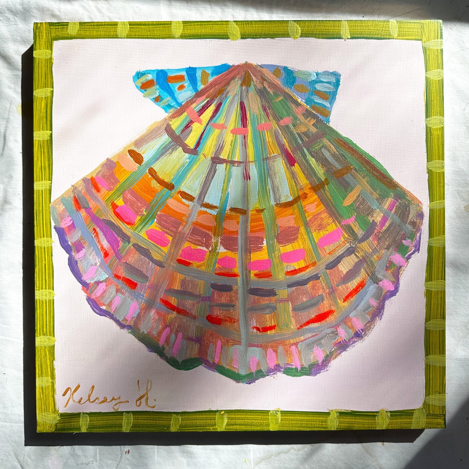 Colorful shell drawing with a green border on a white background