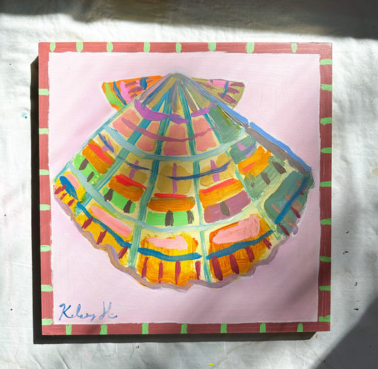 Colorful shell drawing on a pink background with a signature at the bottom left corner.