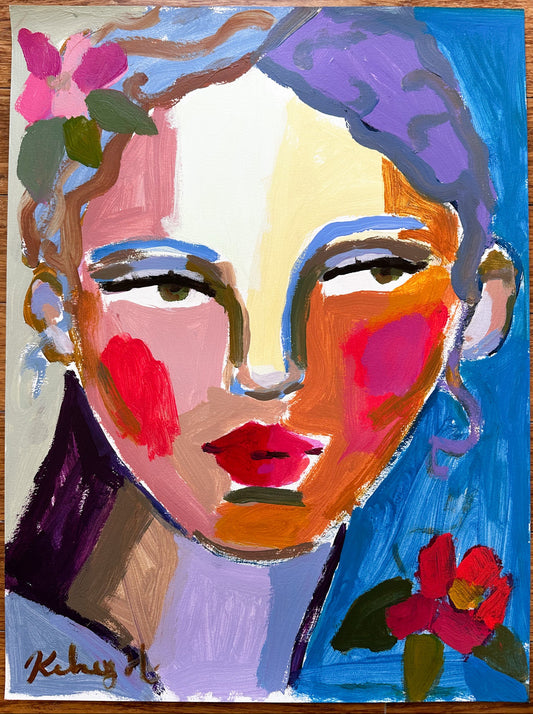 Colorful abstract painting of a face with flowers on a wooden surface